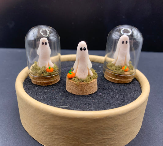 Miniature ghost in glass case