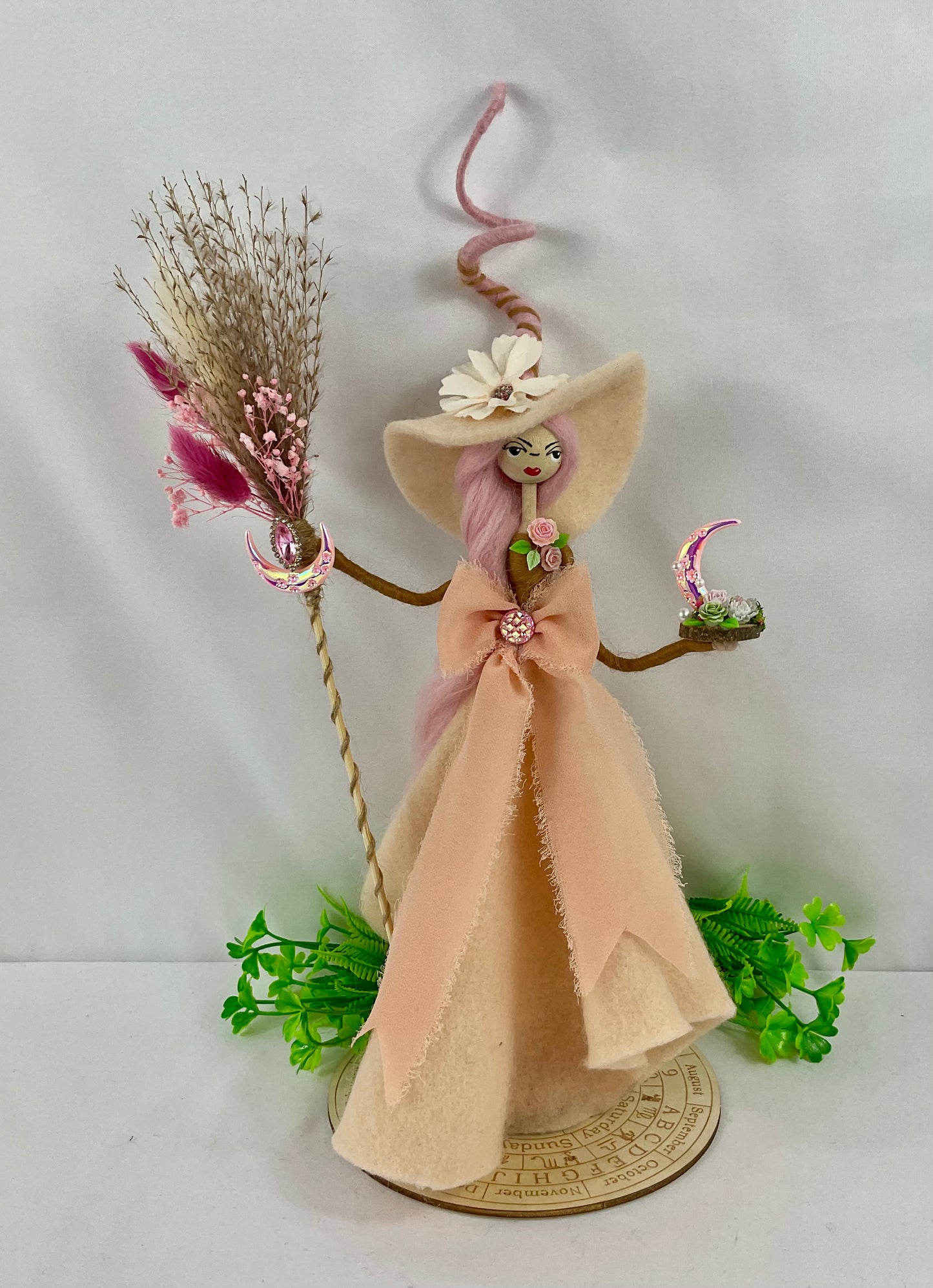 Peachy witch with display board