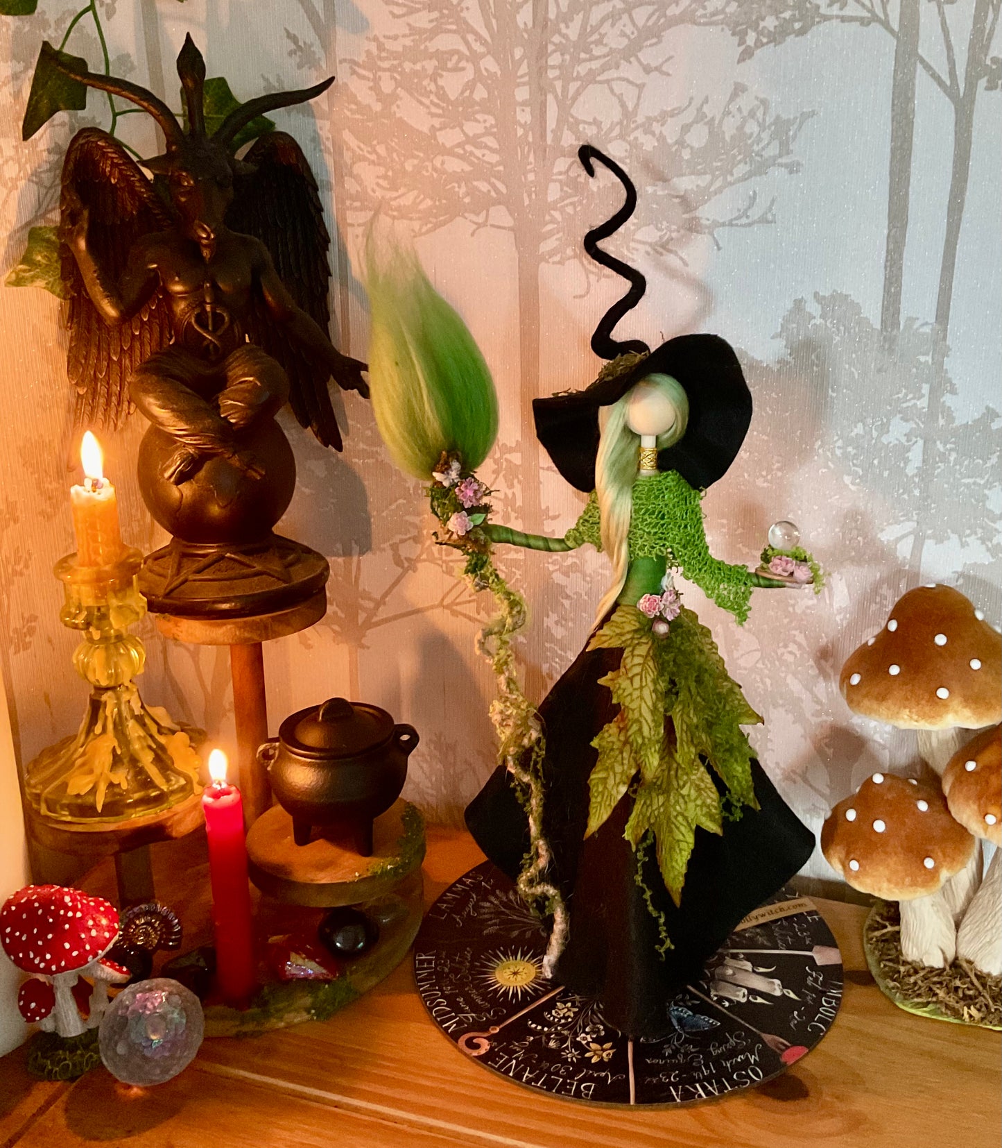 Black and green witch with display disk