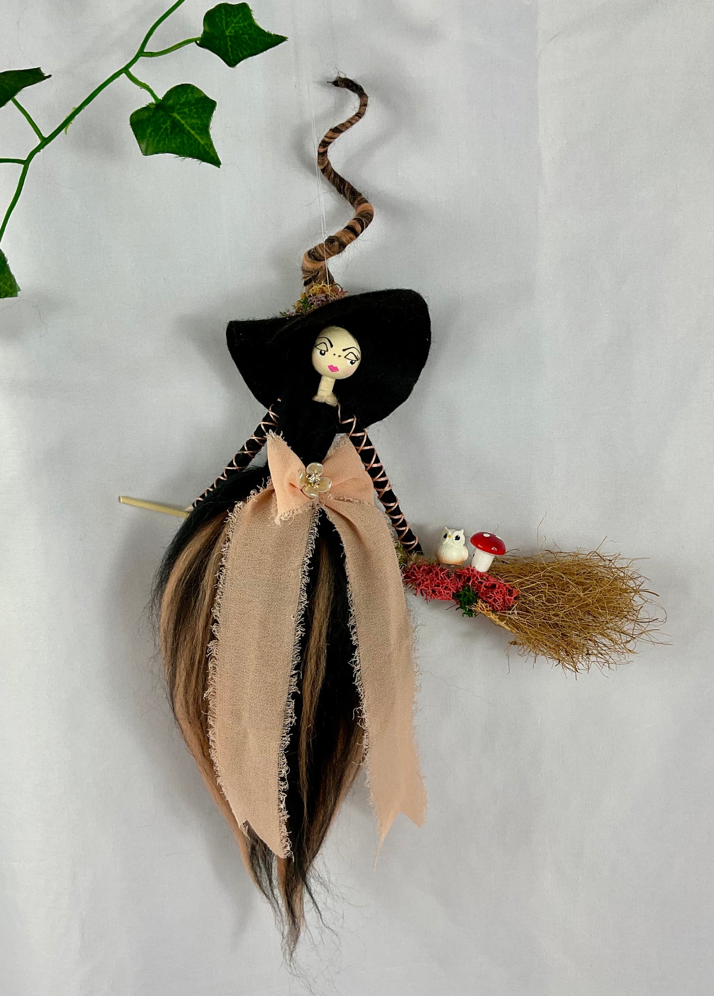 Black and peach flying witch