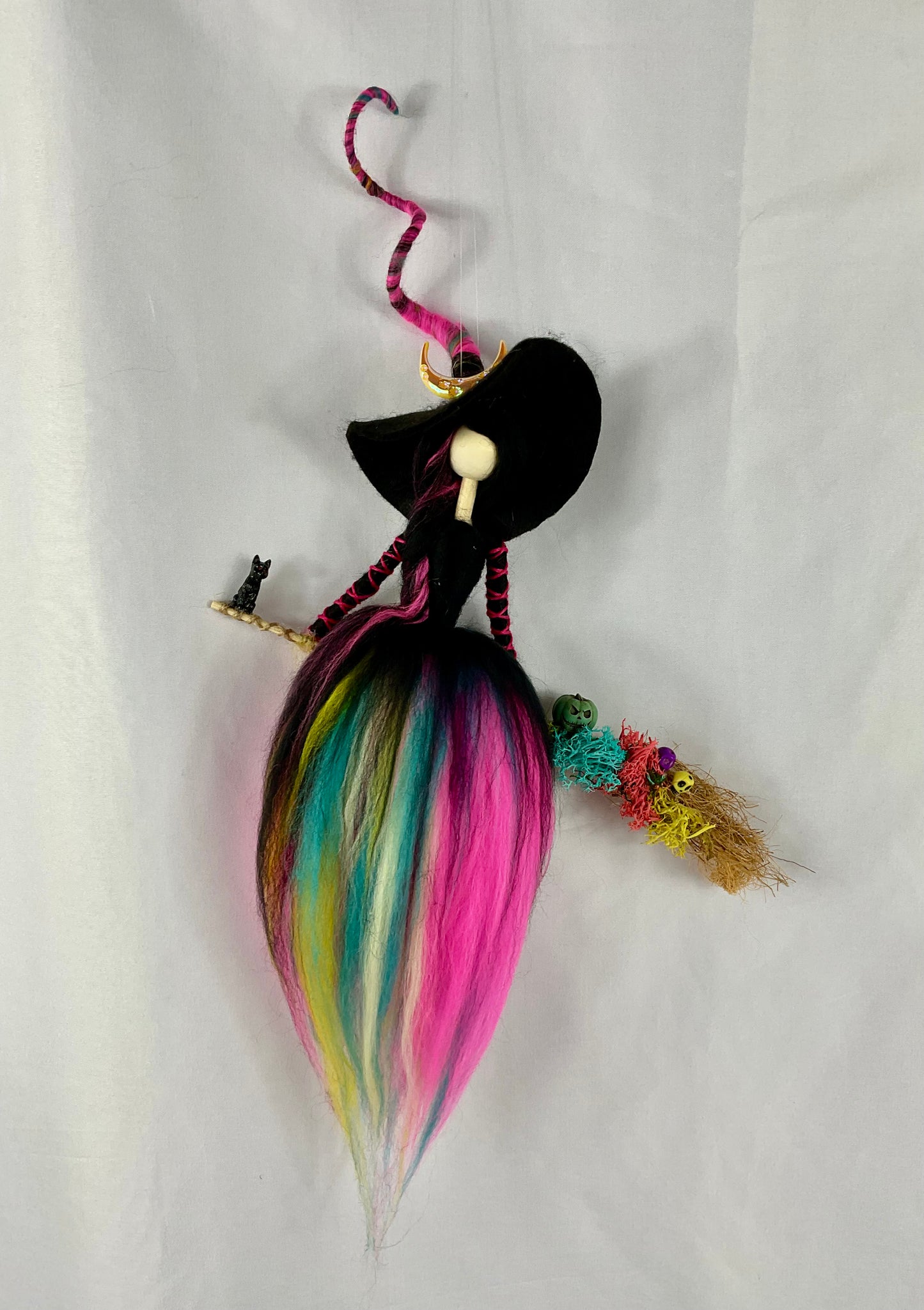 Flying multicoloured witch