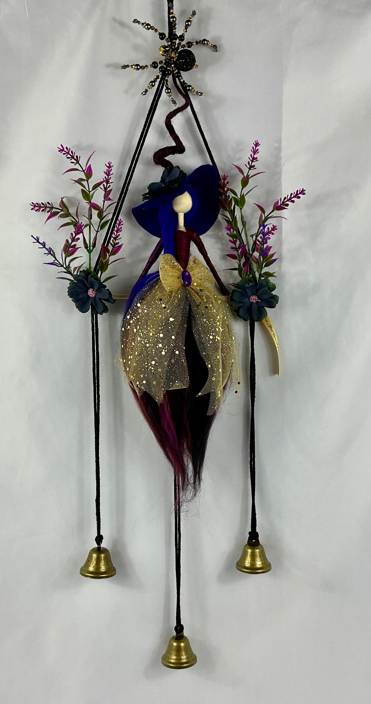 Black, purple and gold woolly witch bells