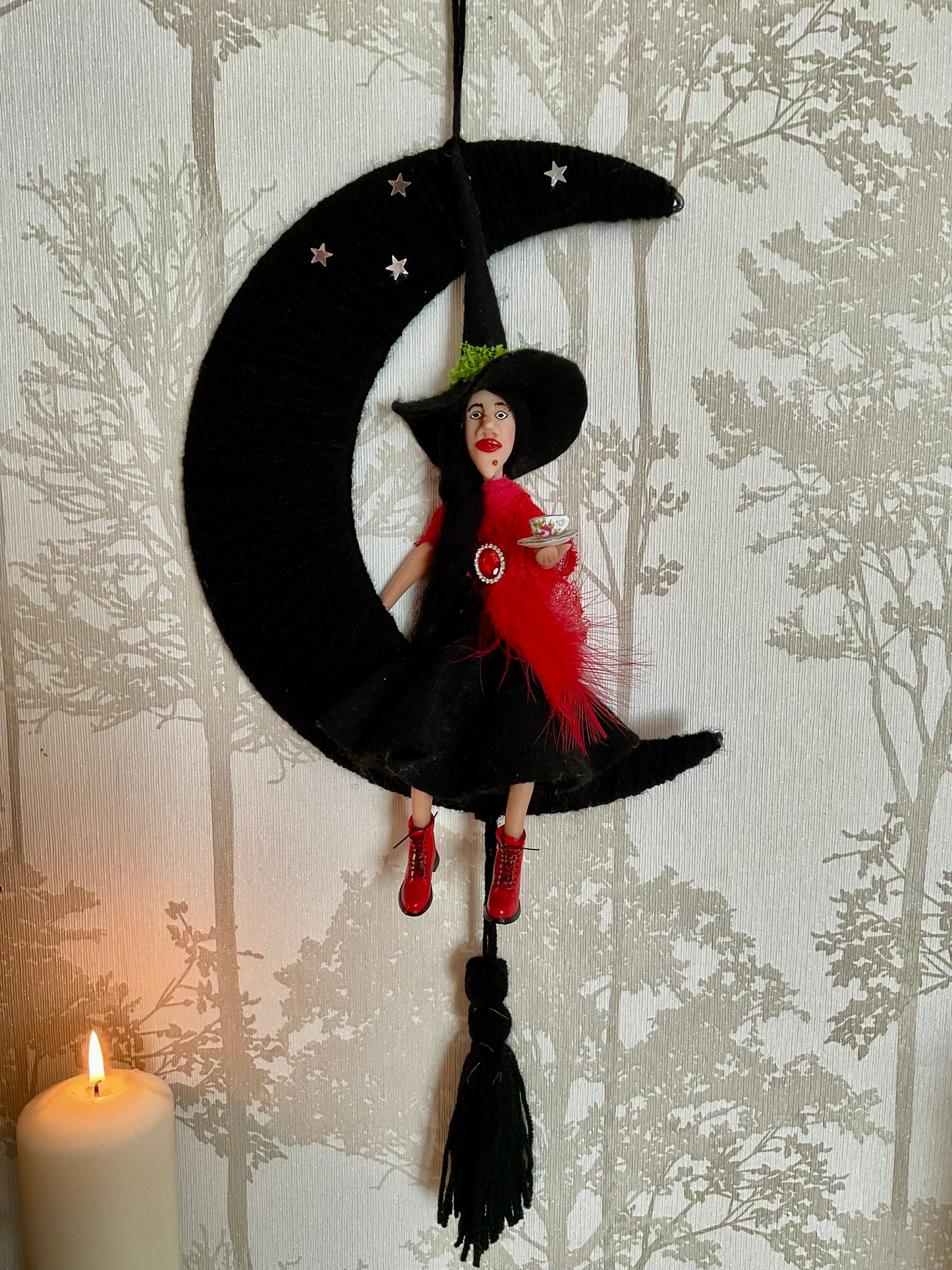 Woolly moon with a clay faced witch