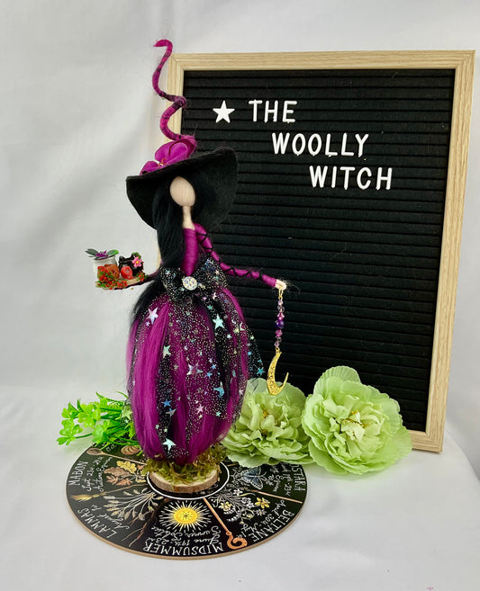 Purple and black witch on a display disk