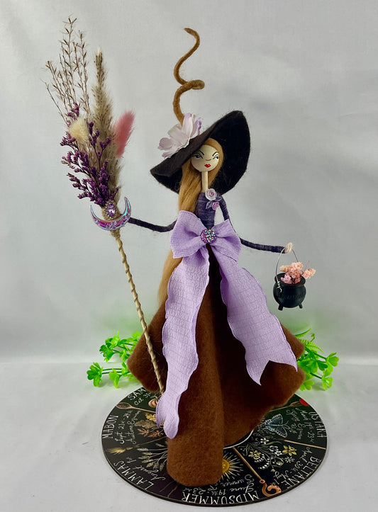 Purple and brown witch with display disk