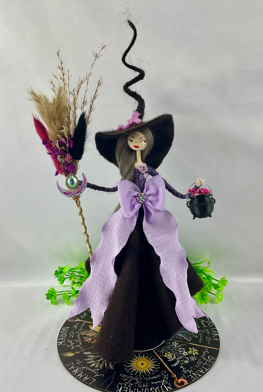 Purple and brown witch with display disk
