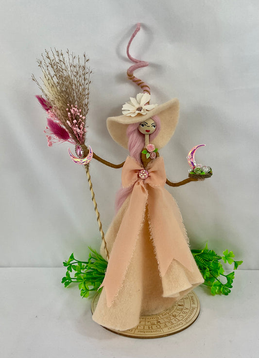 Peachy witch with display board