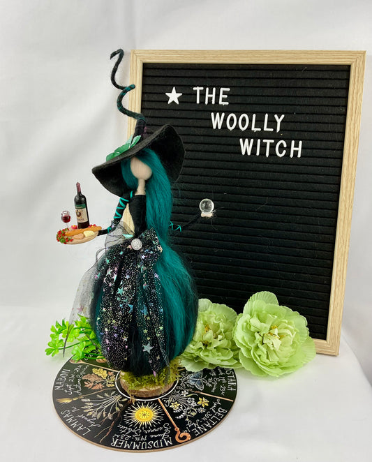Teal and black witch with display disk