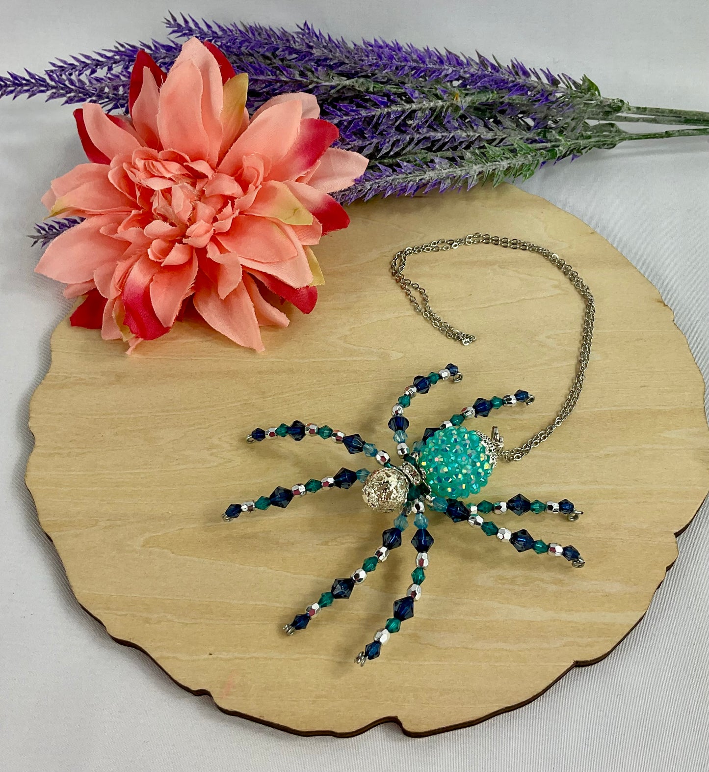 Teal and blue beaded spider tb23