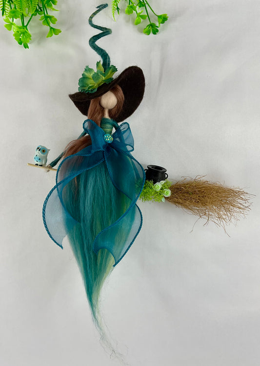 Teal witch on a broom