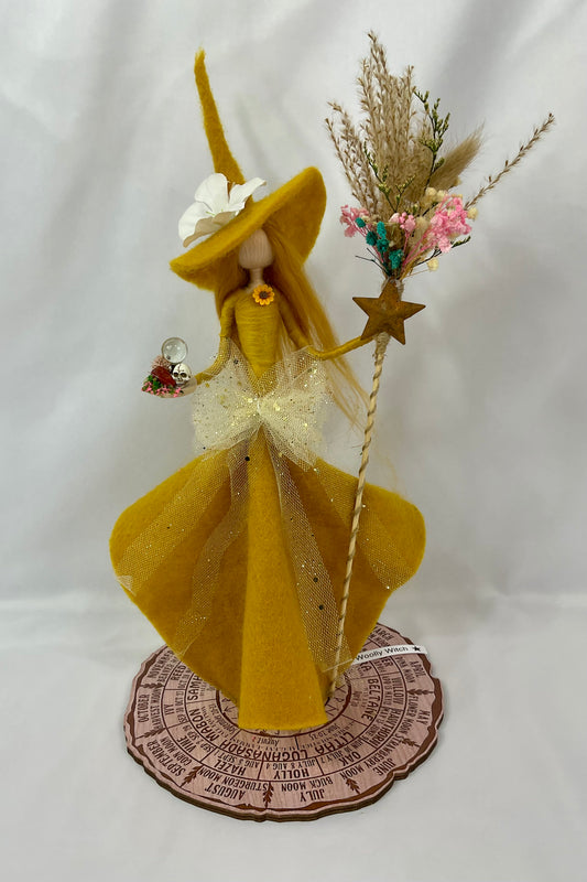 Mustard witch with floral broom and mini red jasper altar