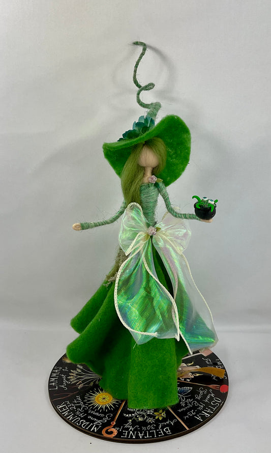 Green witch with mini bubbling cauldrons