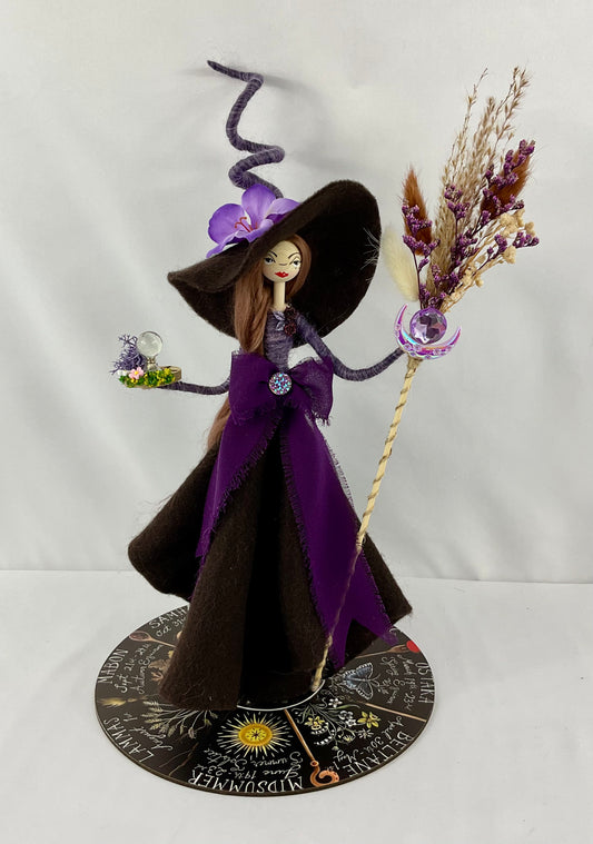 Purple and brown witch and display board