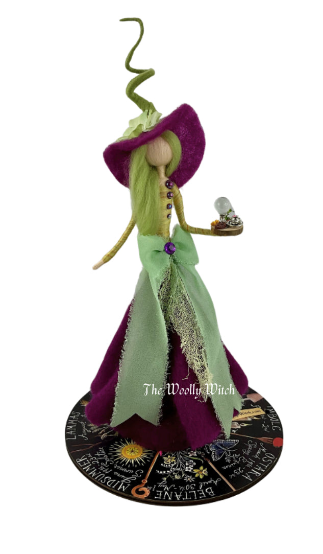 Green and purple witch with mini altar