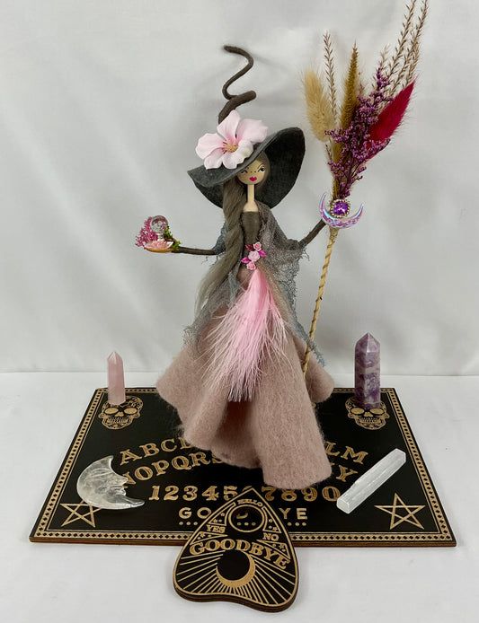 Pink and grey witch with ouija board display and 4 crystals