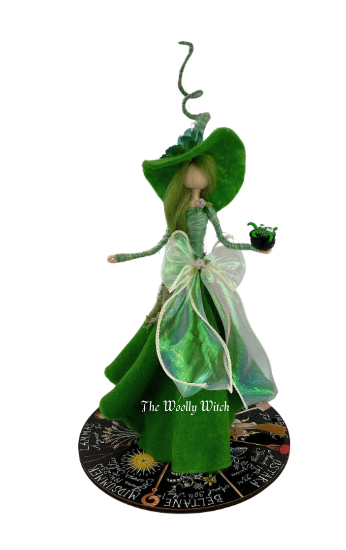 Green witch with mini bubbling cauldrons