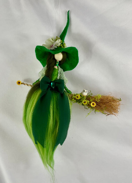Green flying witch