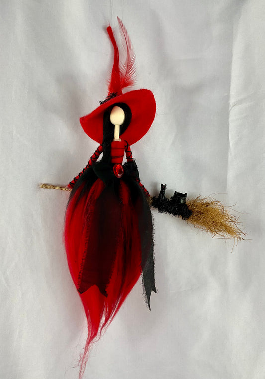Black and red flying witch
