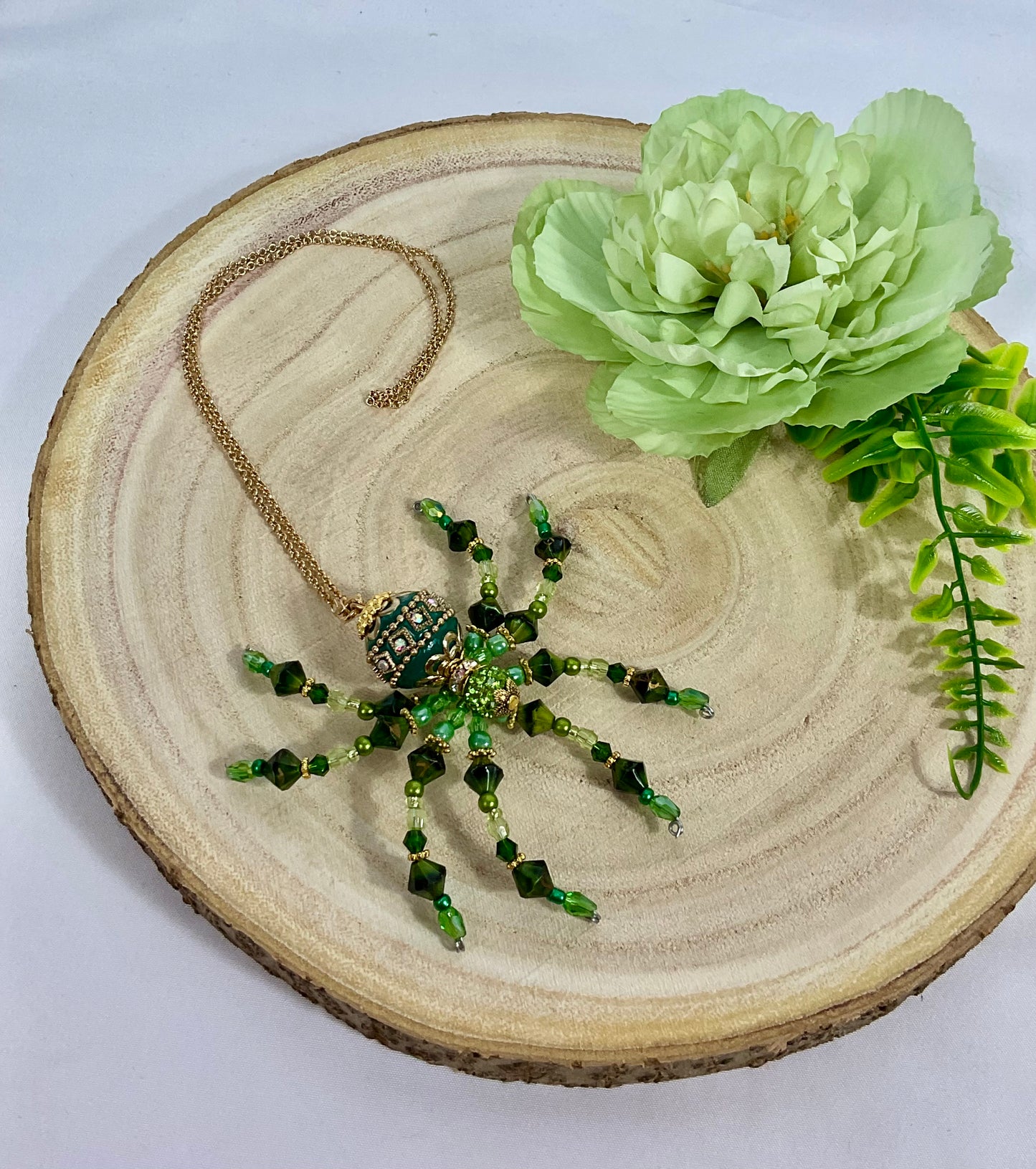 Green and gold beaded spiders gg24