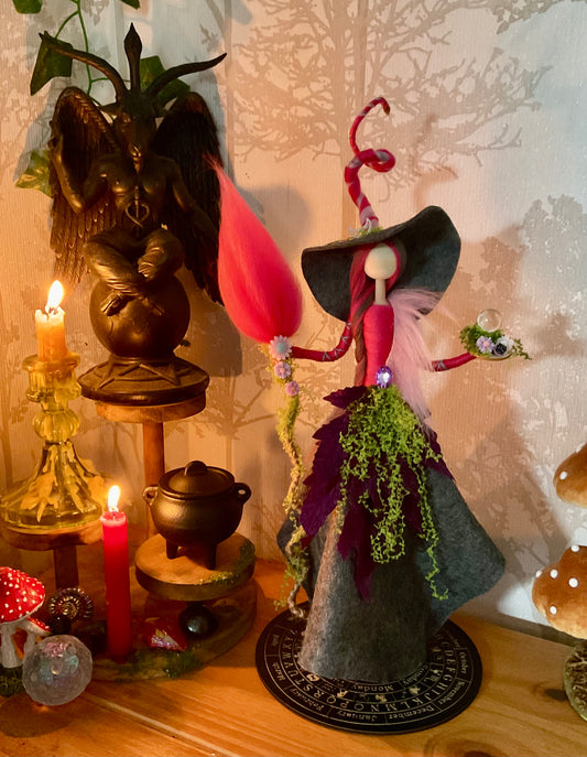 Grey and pink witch with display disk