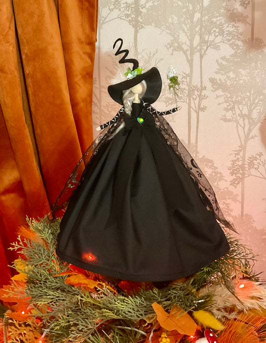 Black witch with star and moon cape.