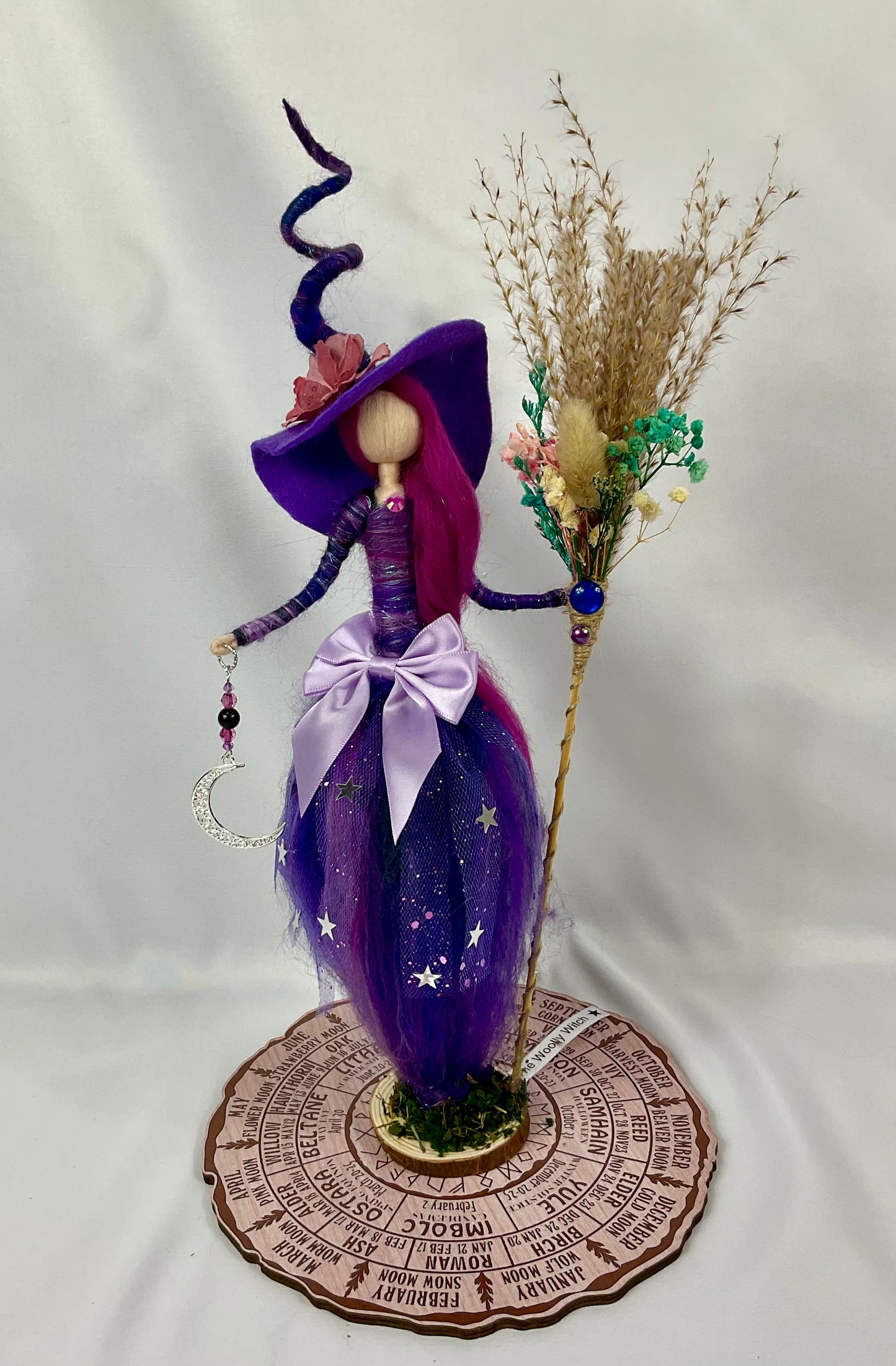 Cosmic witch with floral broom