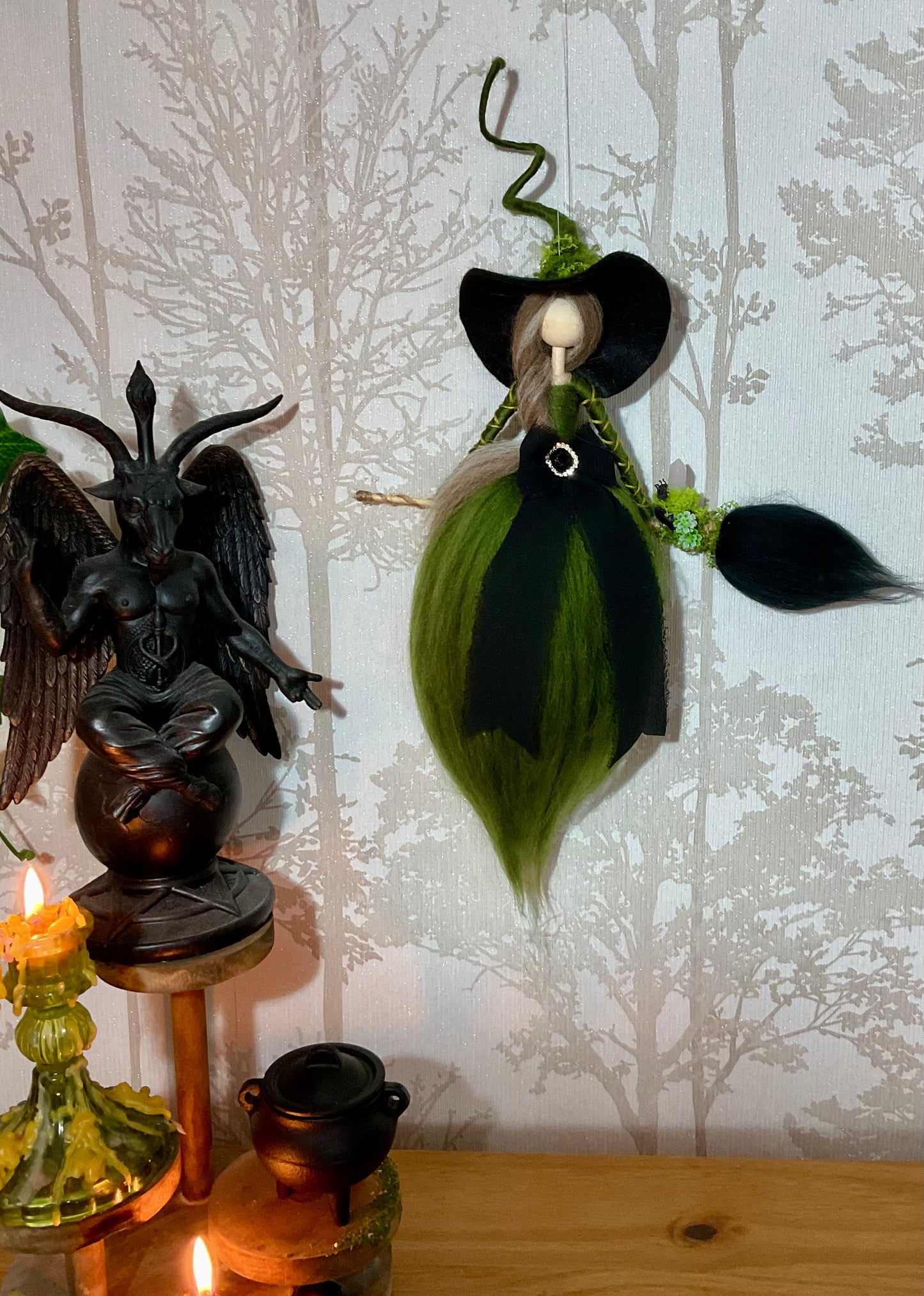 Green and black flying witch
