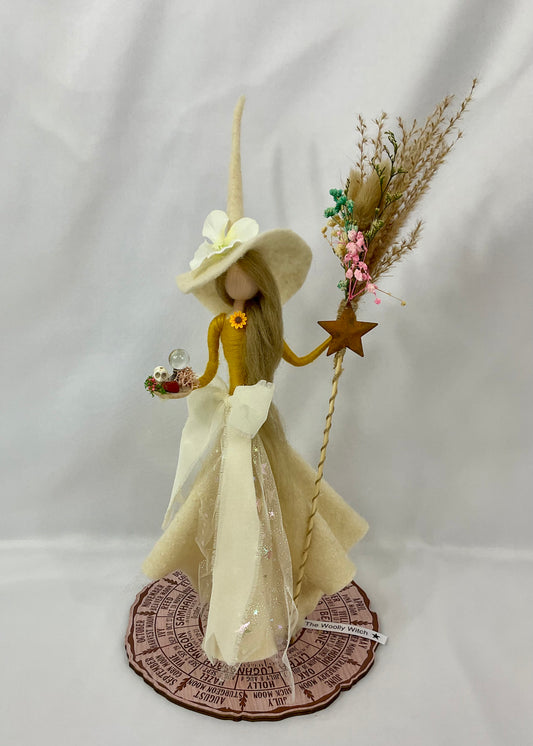 Cream and mustard witch with floral broom and mini red jasper altar