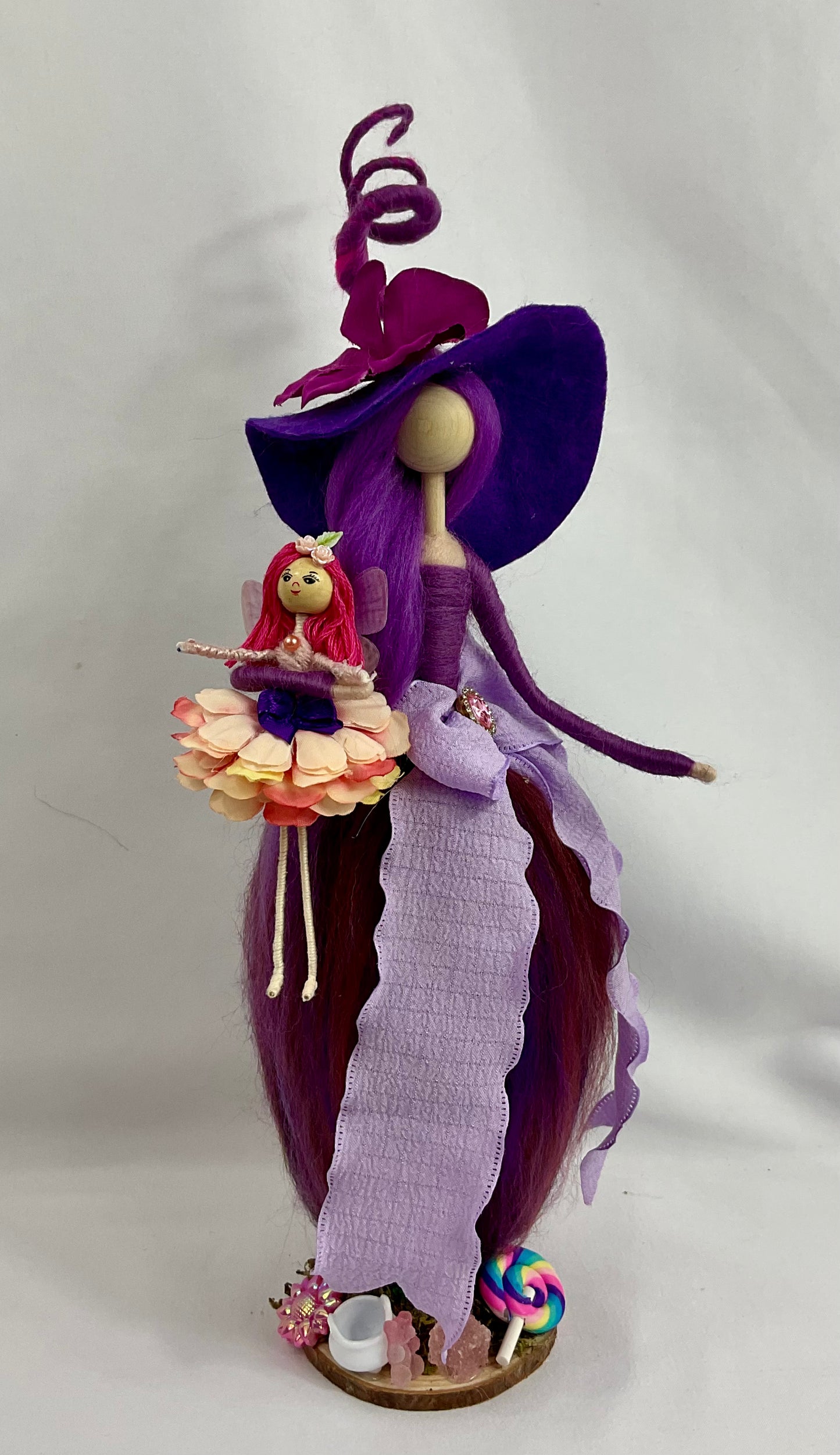 Forever young witch and her fairy doll