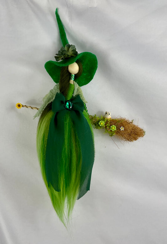 Green flying witch
